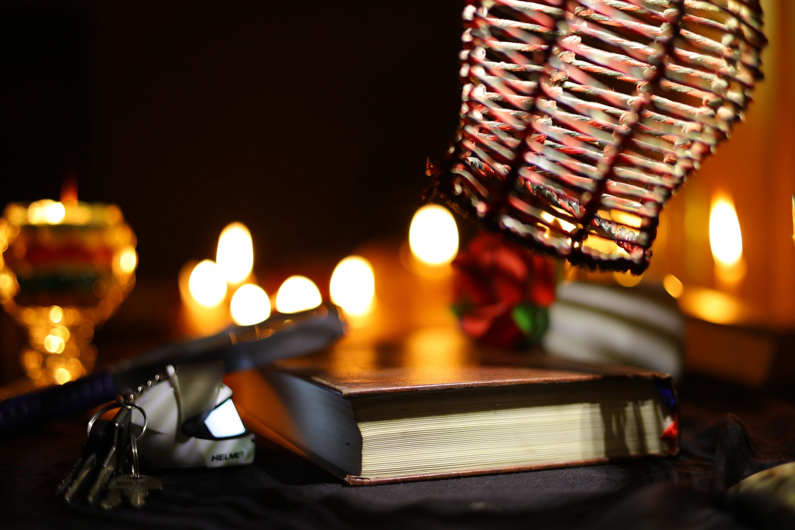 Books and candlelight in a warm reading setting